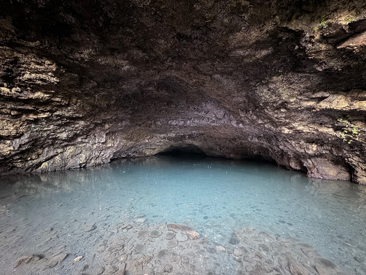 a cave with a body of water