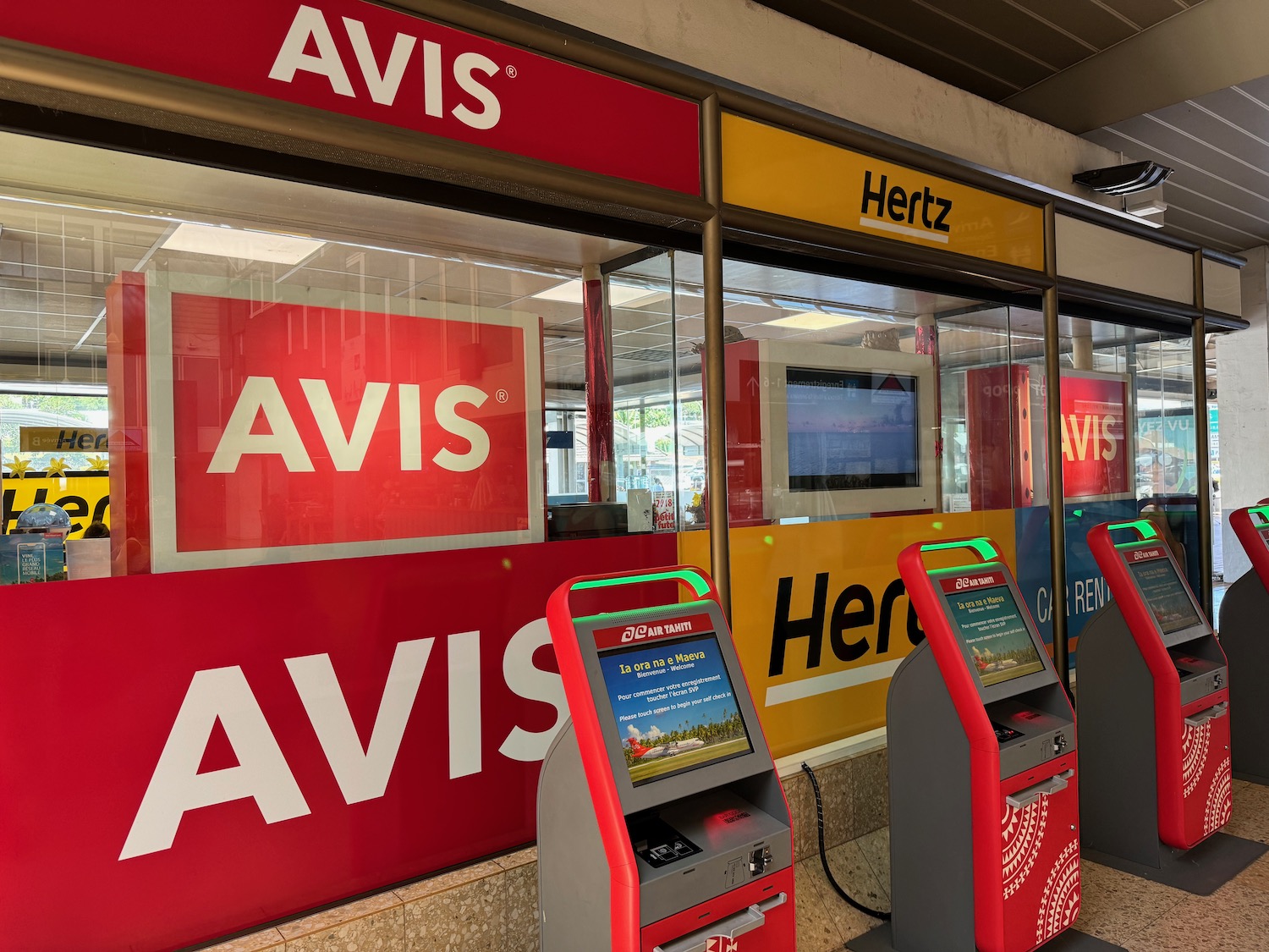 a row of kiosks in front of a store