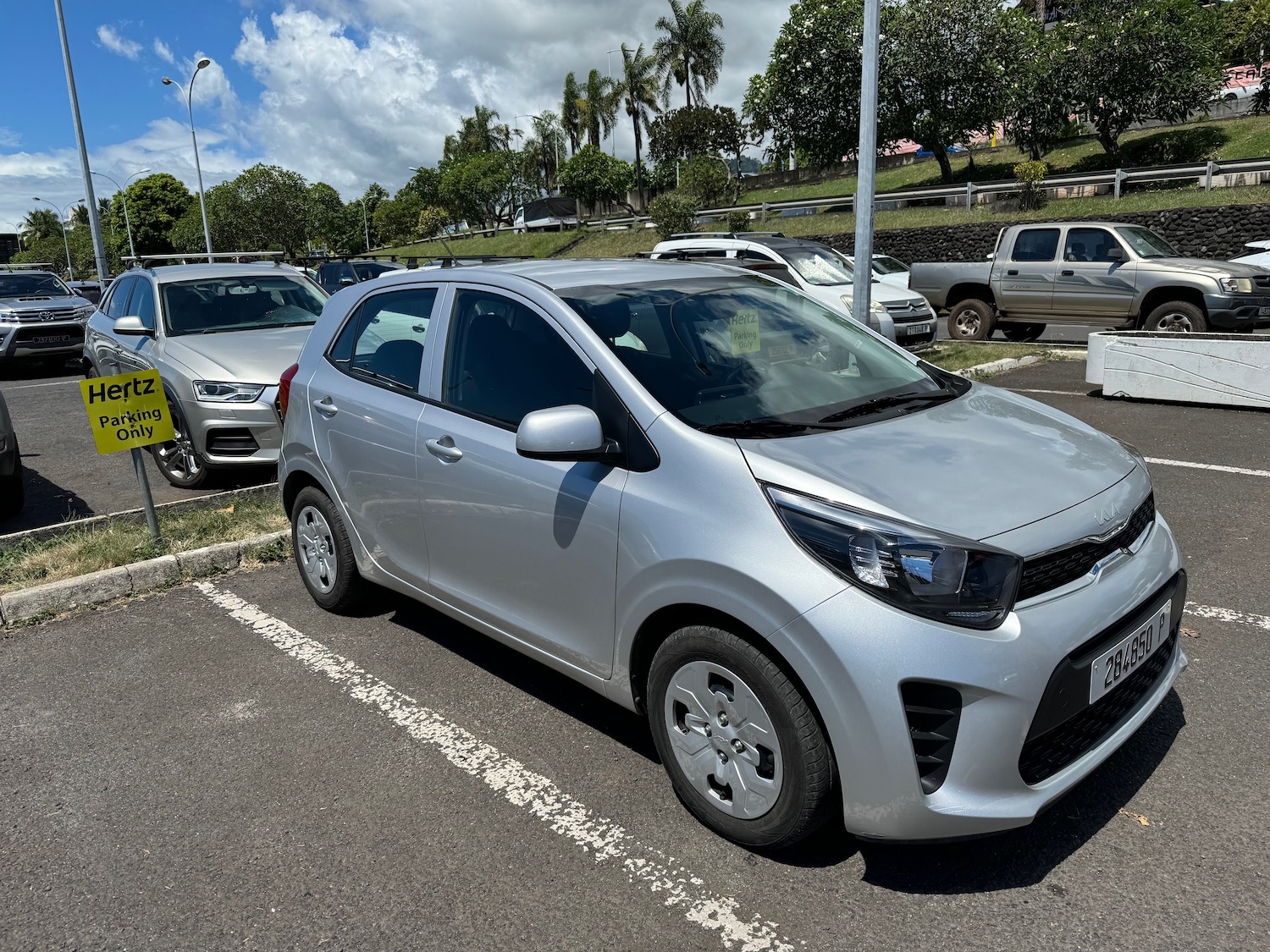 a group of cars parked in a parking lot