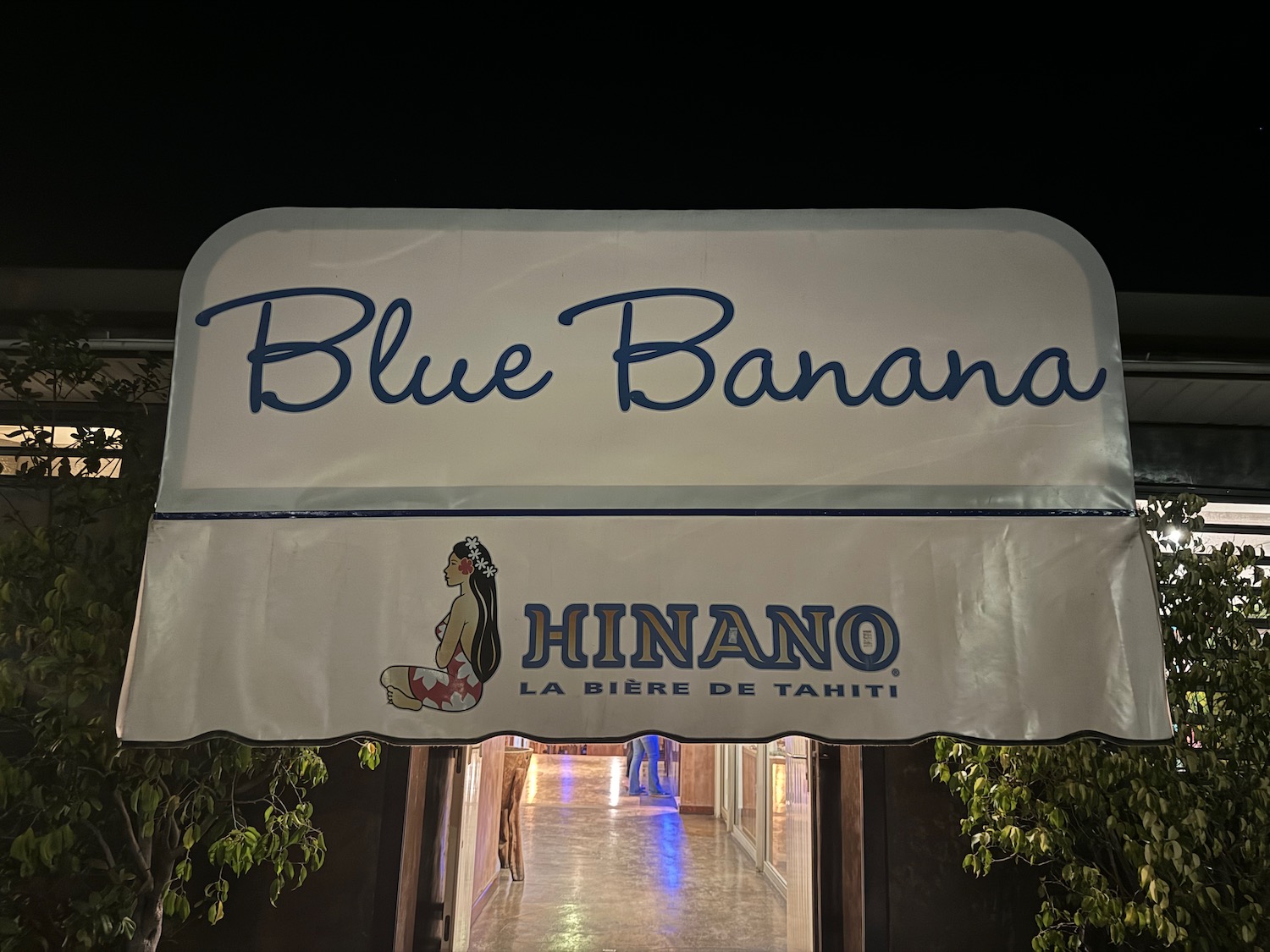 a sign with a white cover and blue text