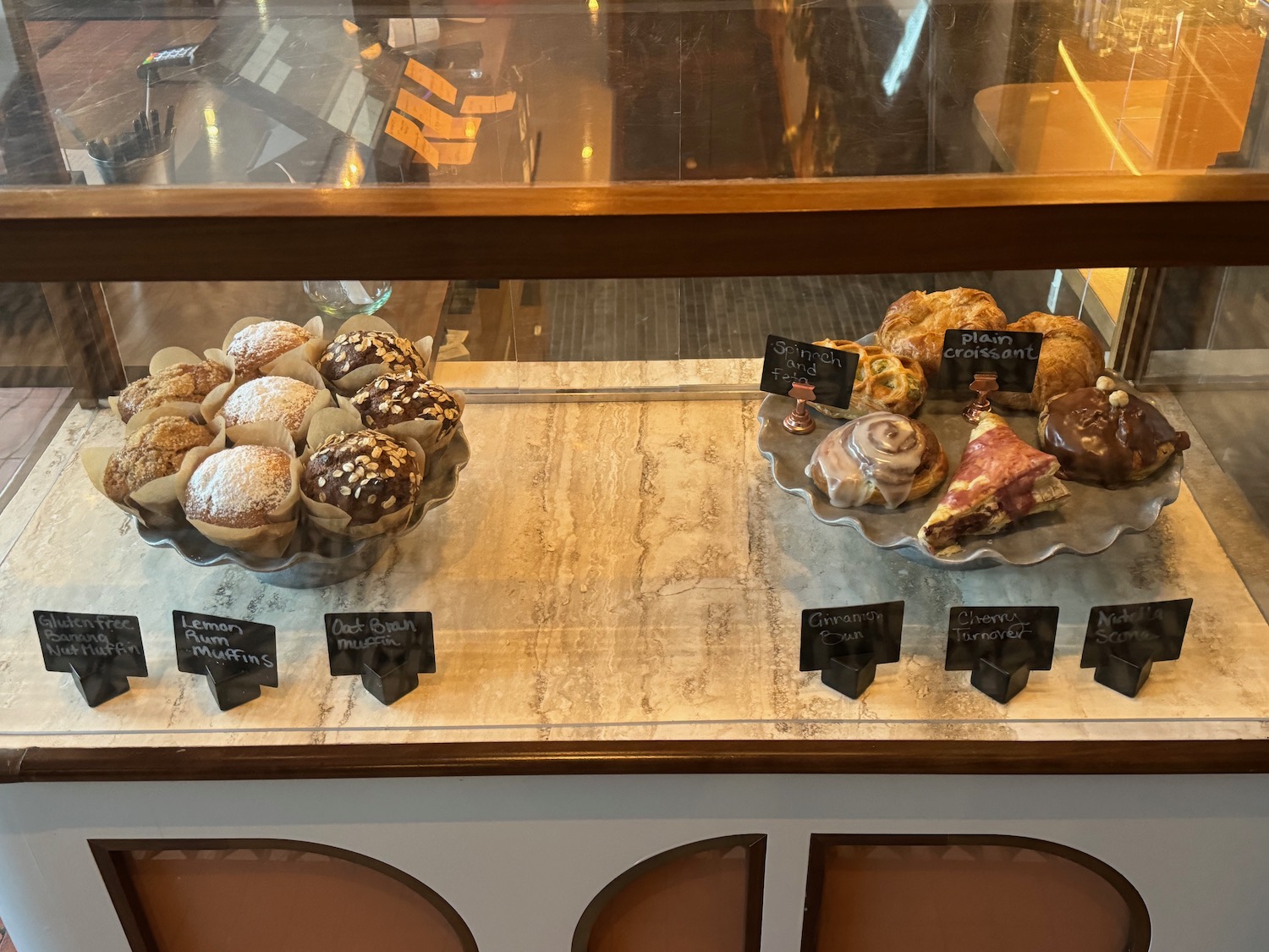 a display case with pastries and pastries