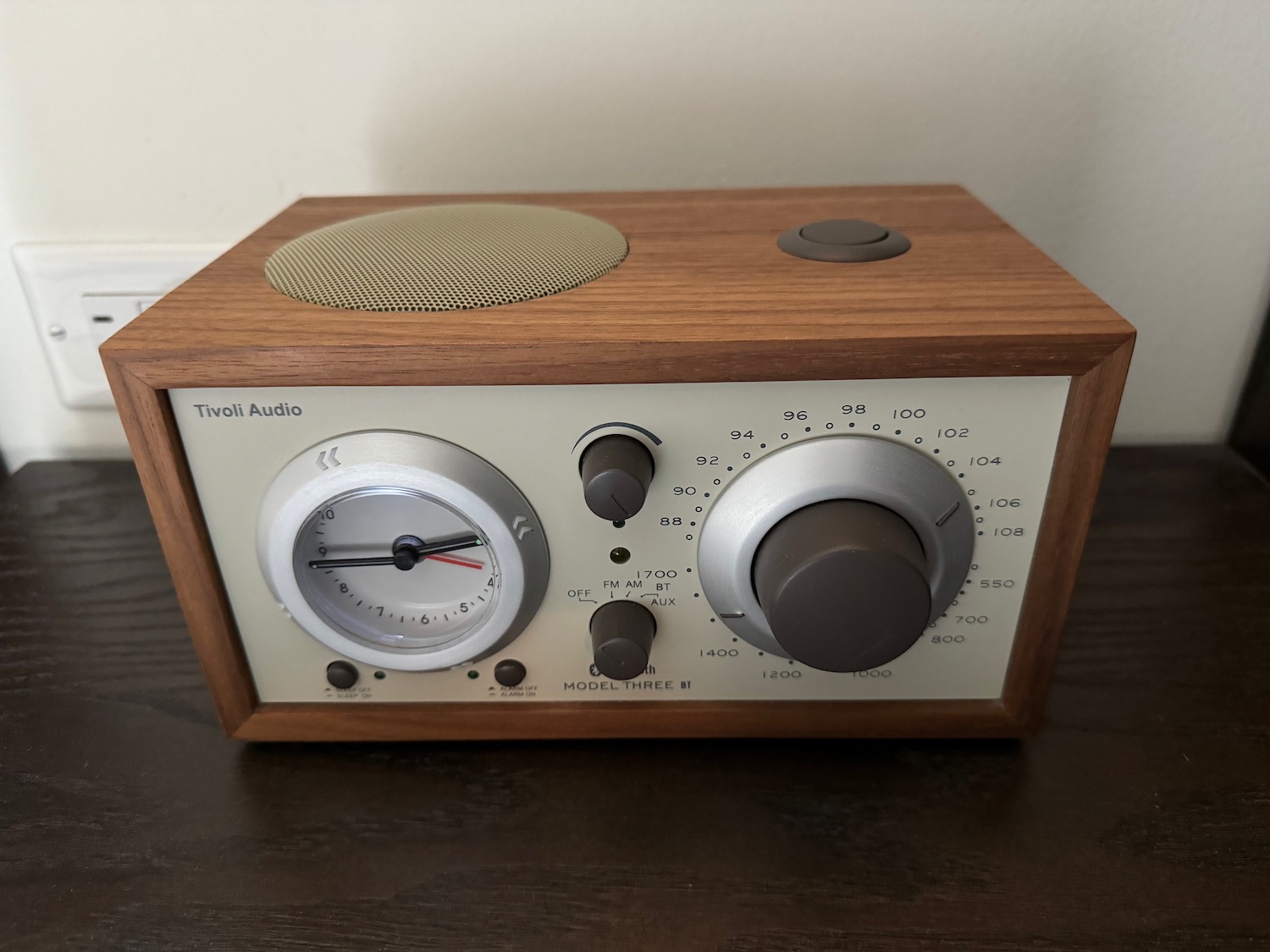 a wooden box with knobs and dials