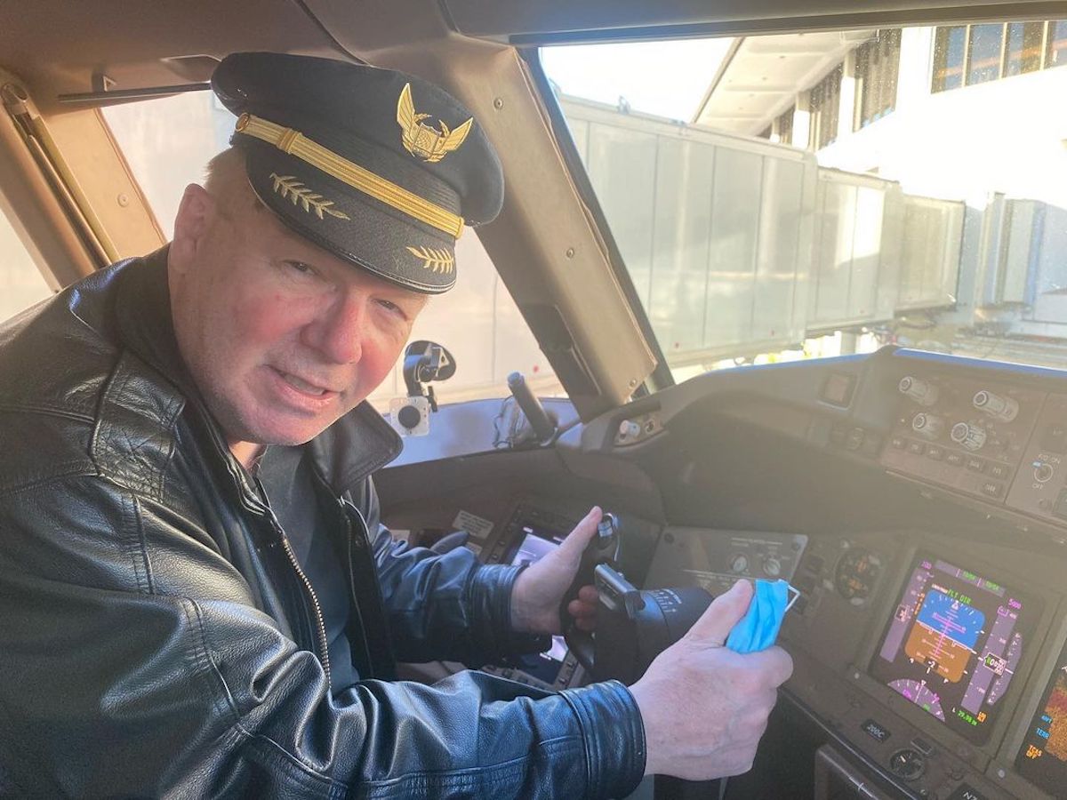 a man in a pilot's hat