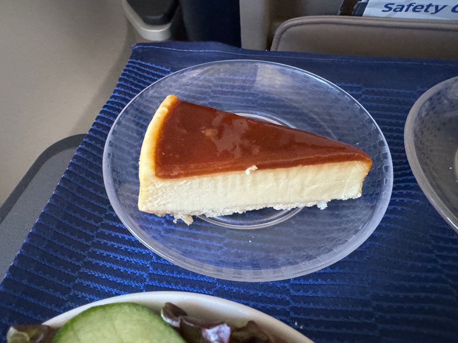 a slice of cheesecake on a clear plate