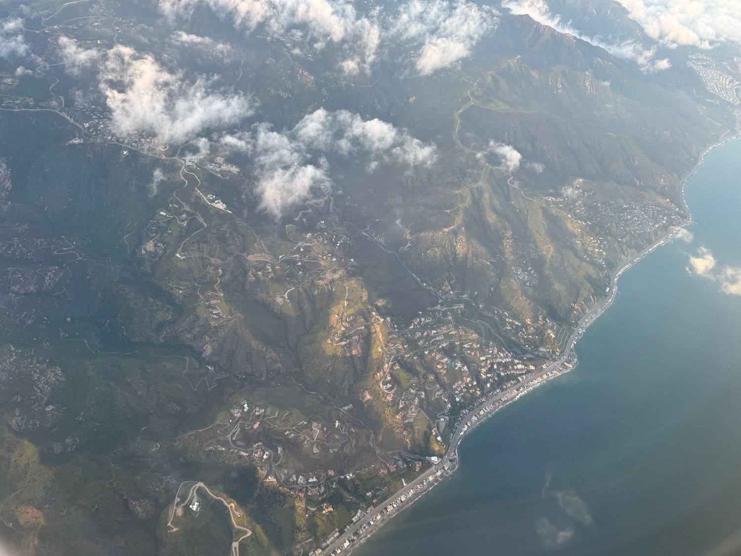 aerial view of a body of water and a city