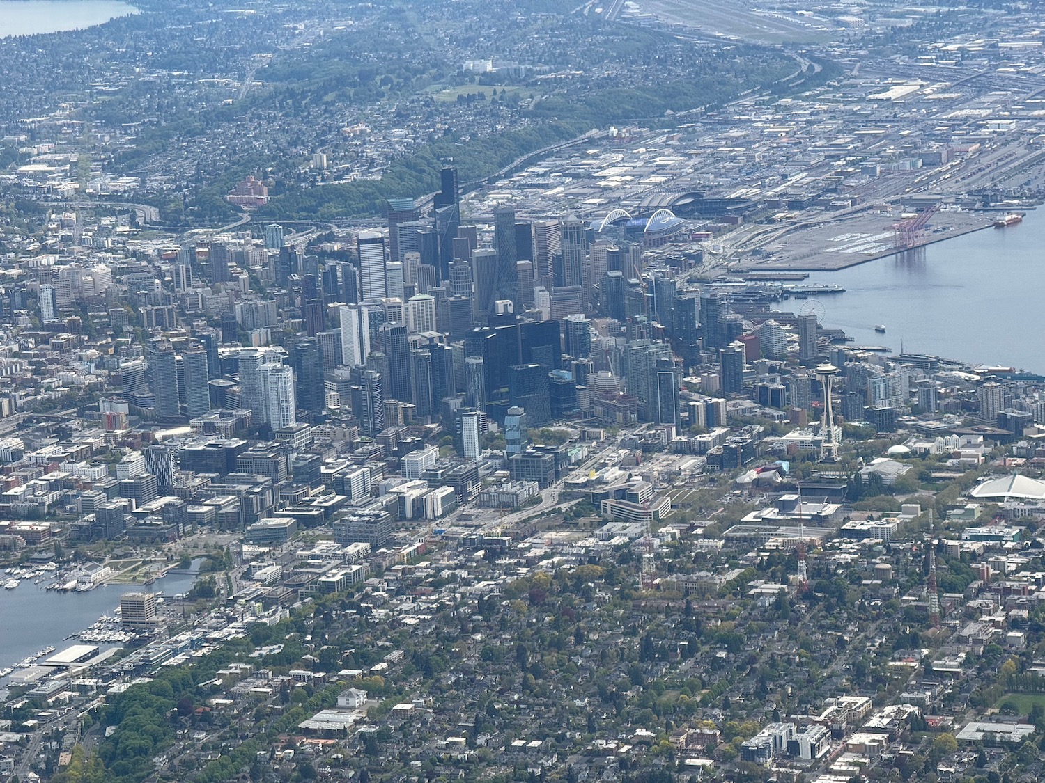 a city with many tall buildings and a body of water