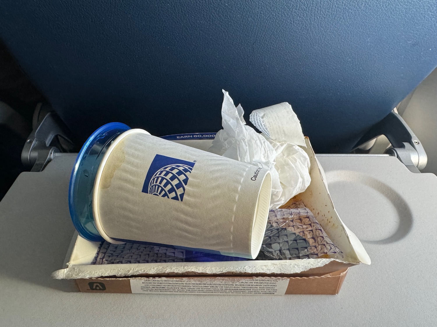 a cup and napkin in a box