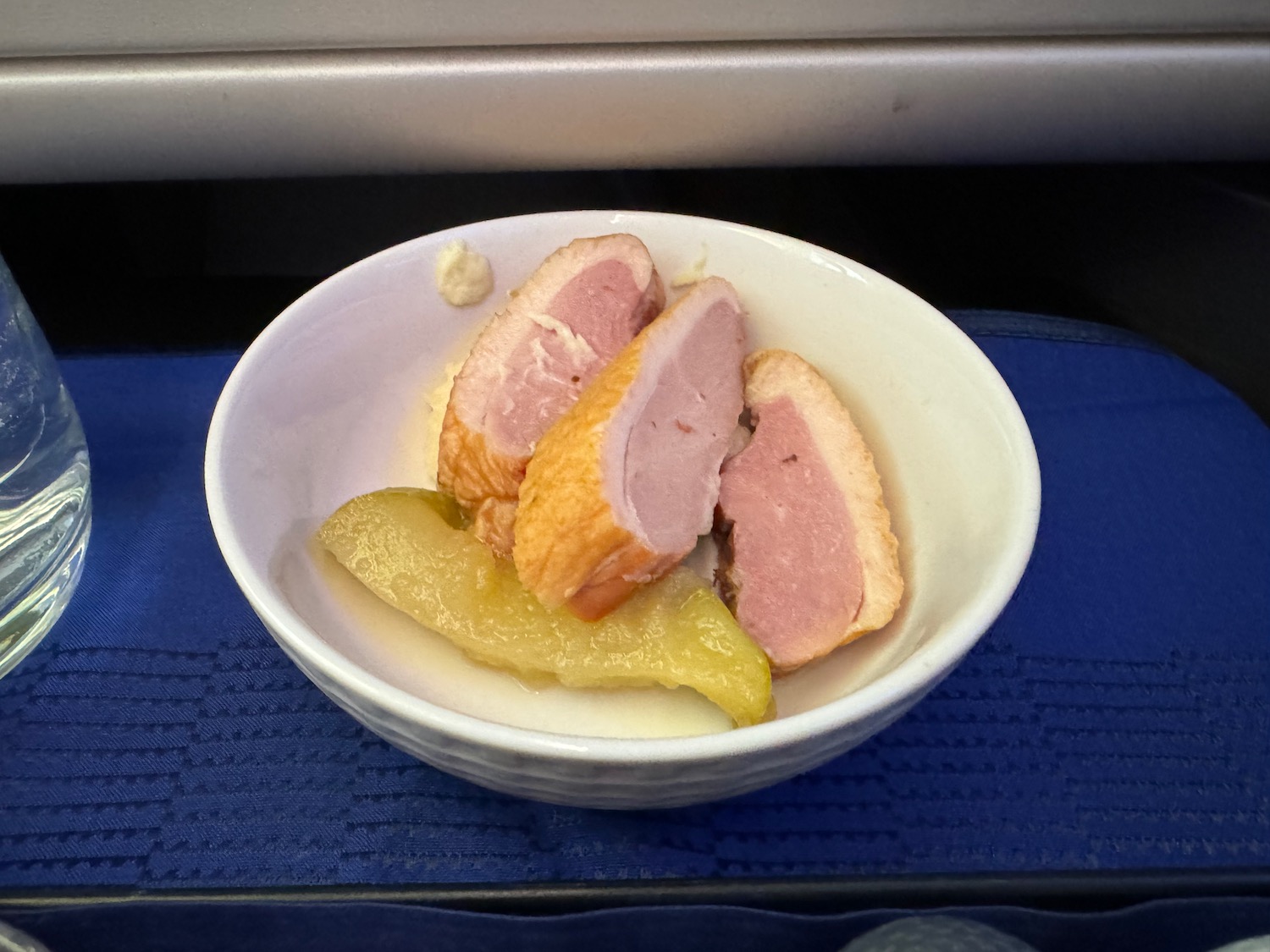 a bowl of food on a blue surface