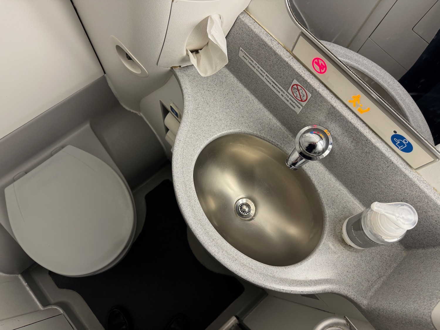 a sink and toilet in a plane