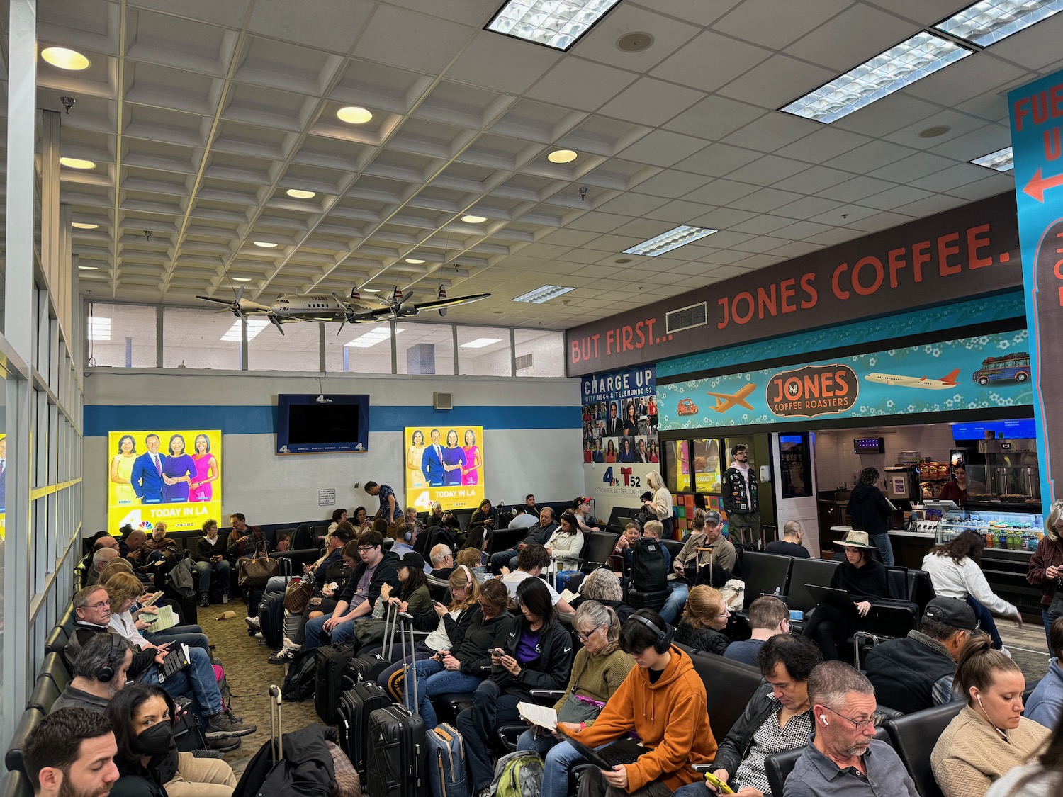 a group of people sitting in a waiting room