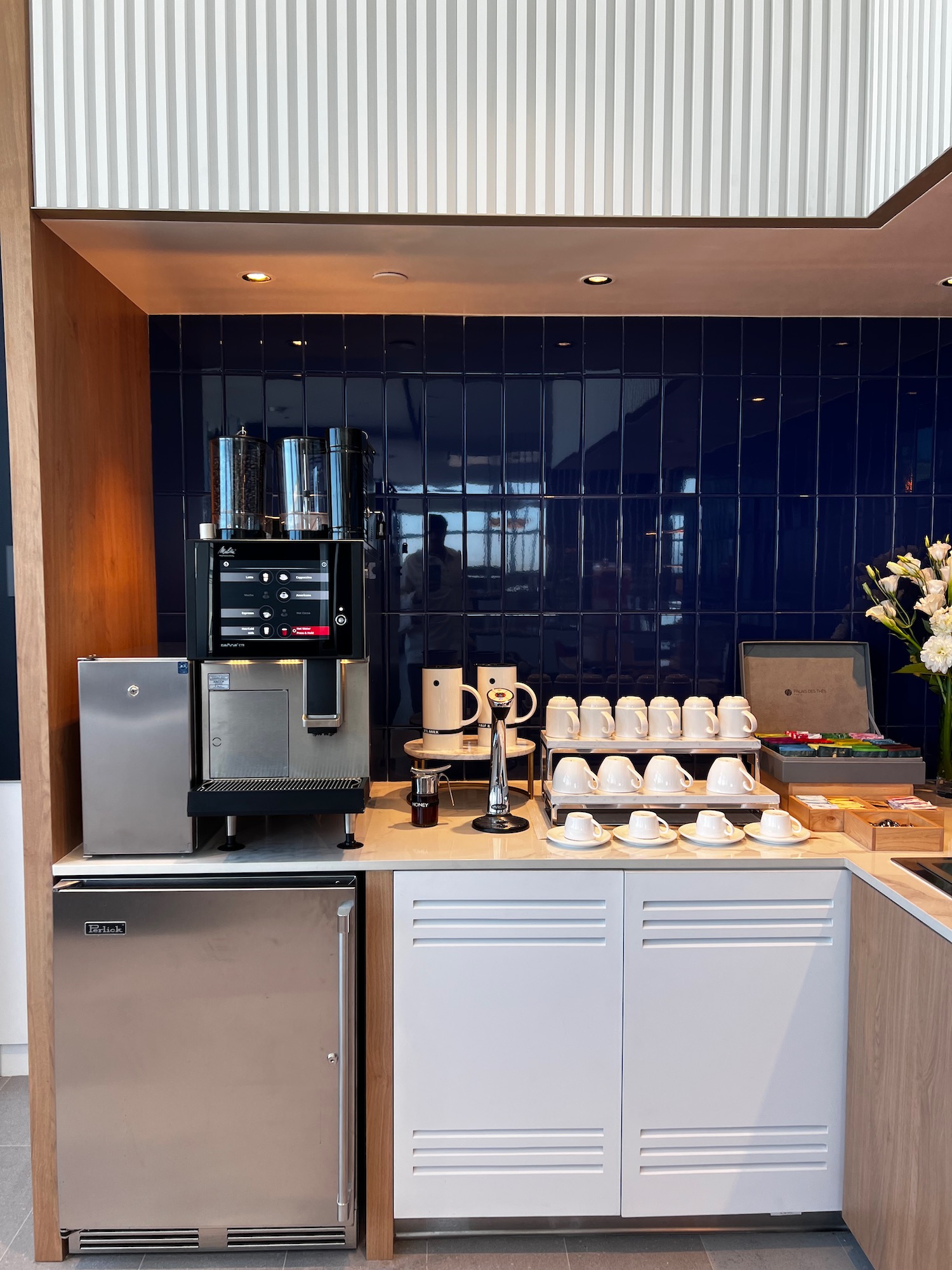 a coffee machine and coffee maker on a counter