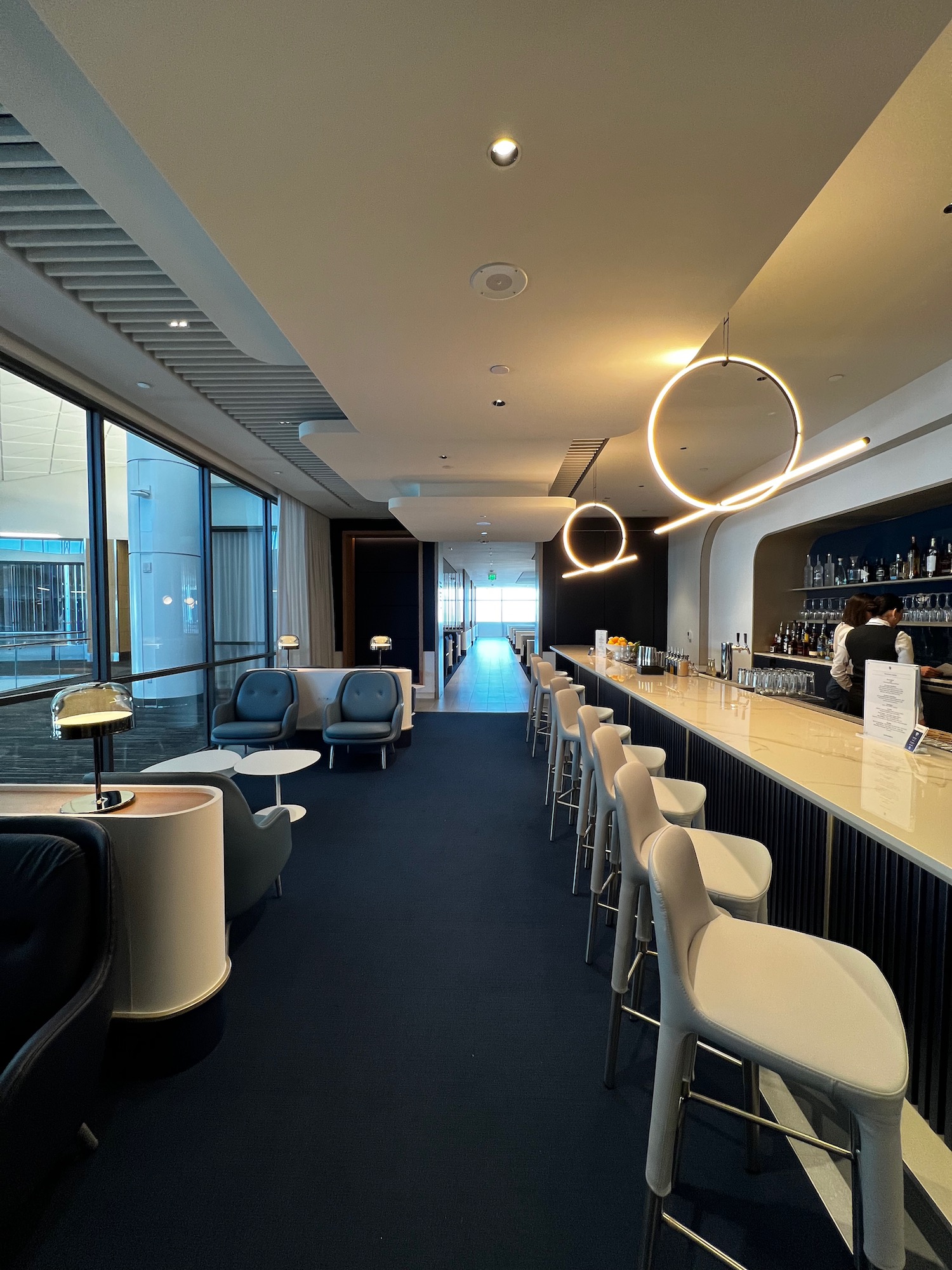 a bar with chairs and a counter