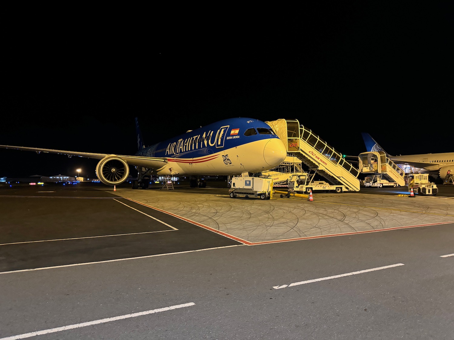 a plane on the tarmac at night