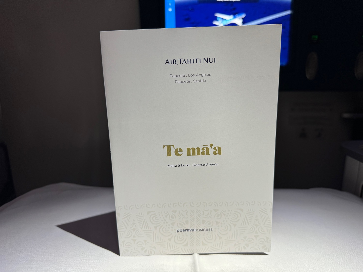 a white paper with gold text on it