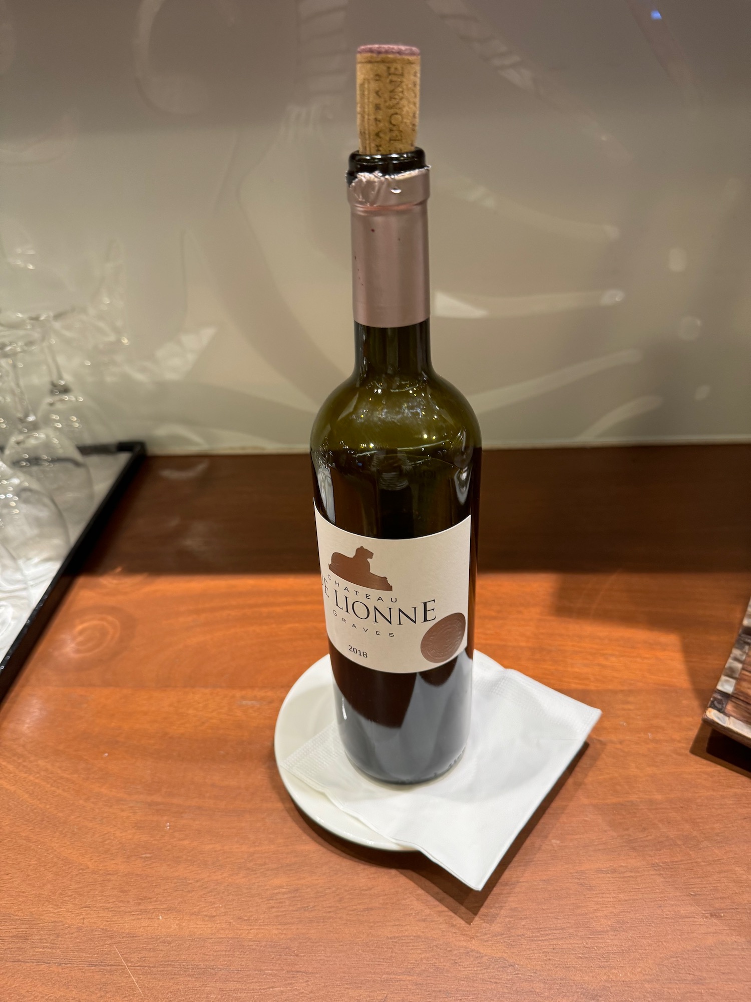 a bottle of wine on a plate