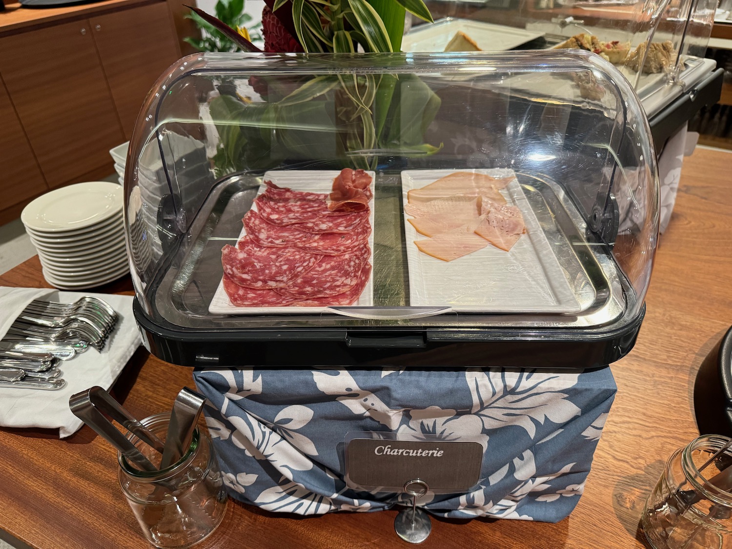 a tray of meat and ham on a table