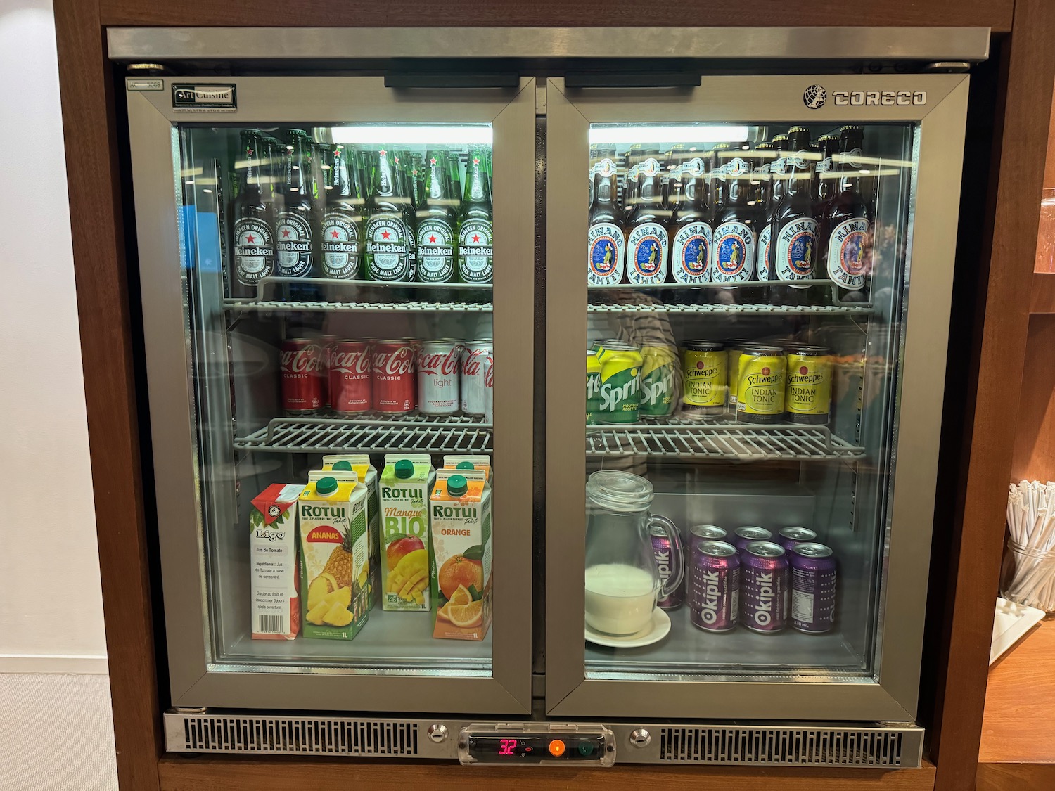 a refrigerator with drinks and beverages