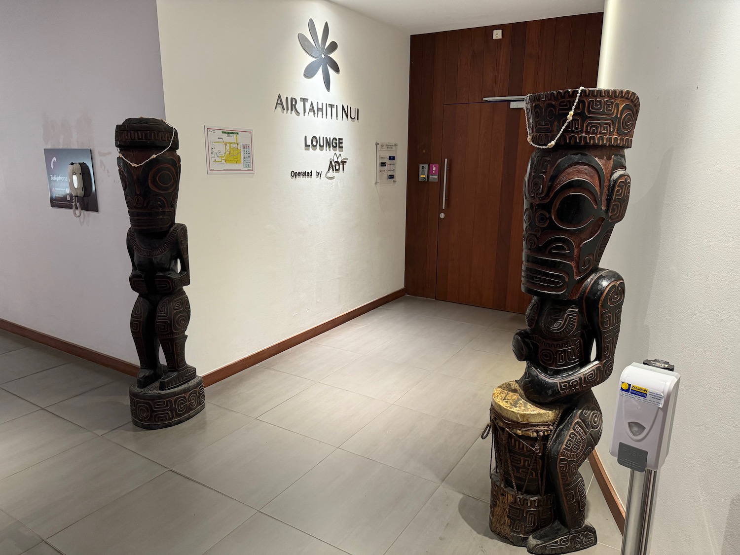 a wooden statues in a room