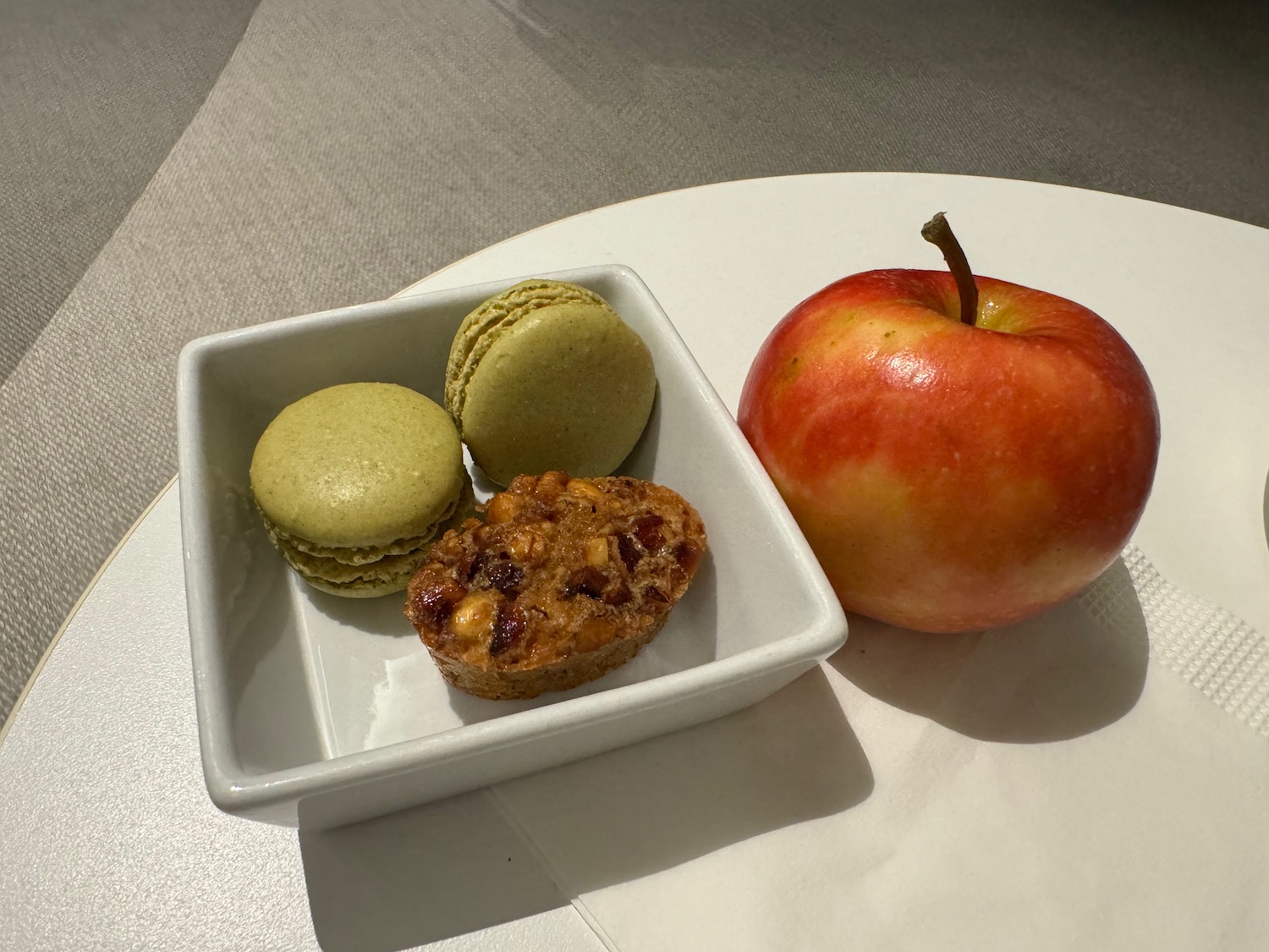 a plate of food and an apple