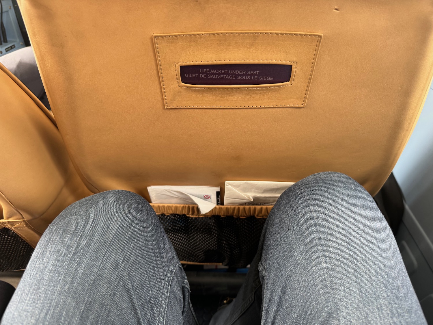 a person's legs in a seat