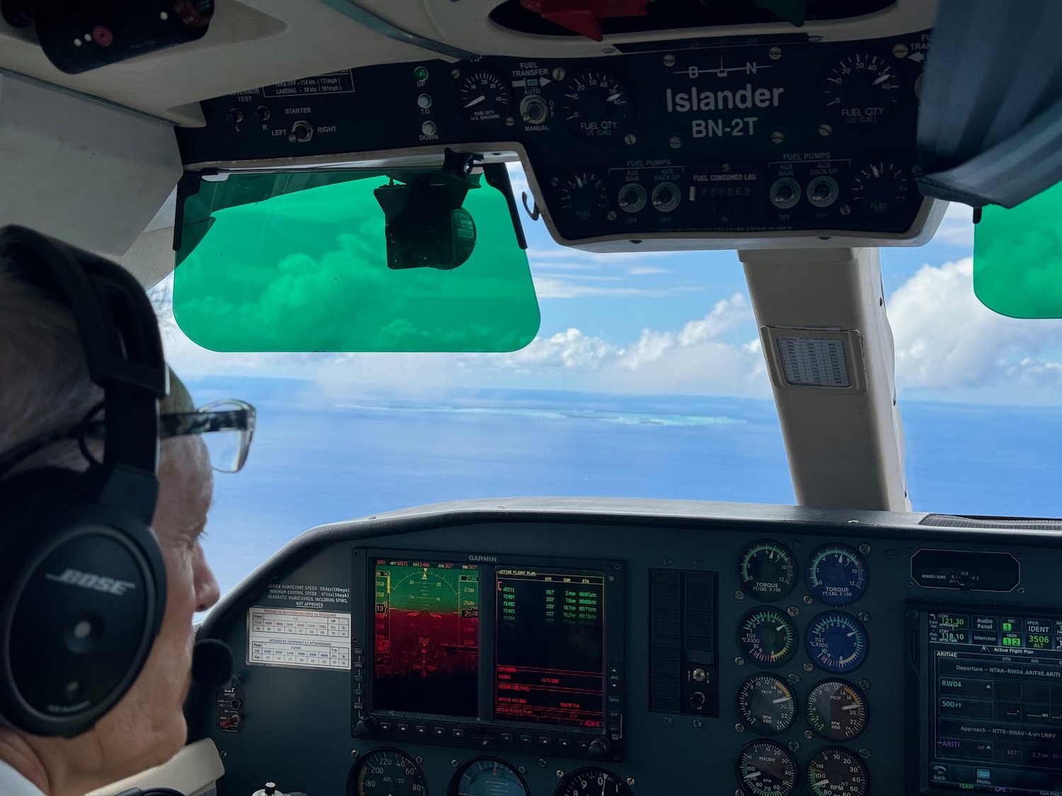 a man in a cockpit of a plane