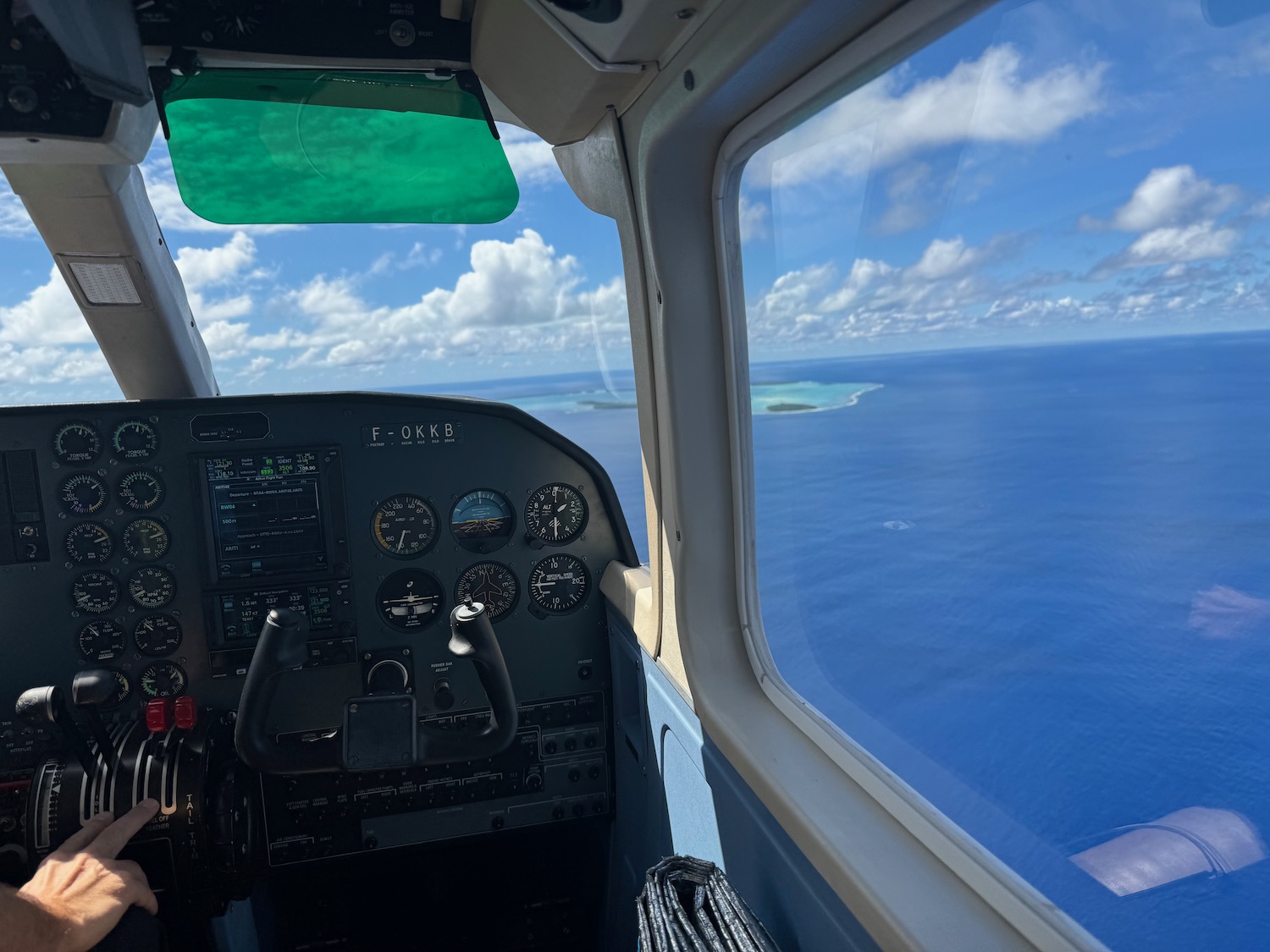 a cockpit of a plane with a view of the ocean