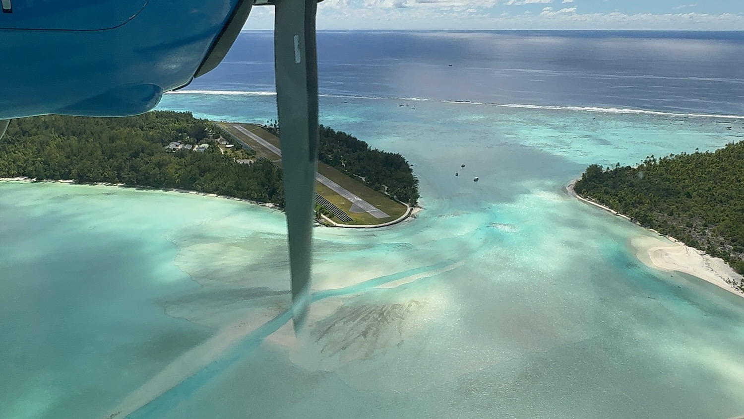 an aerial view of a small island and land