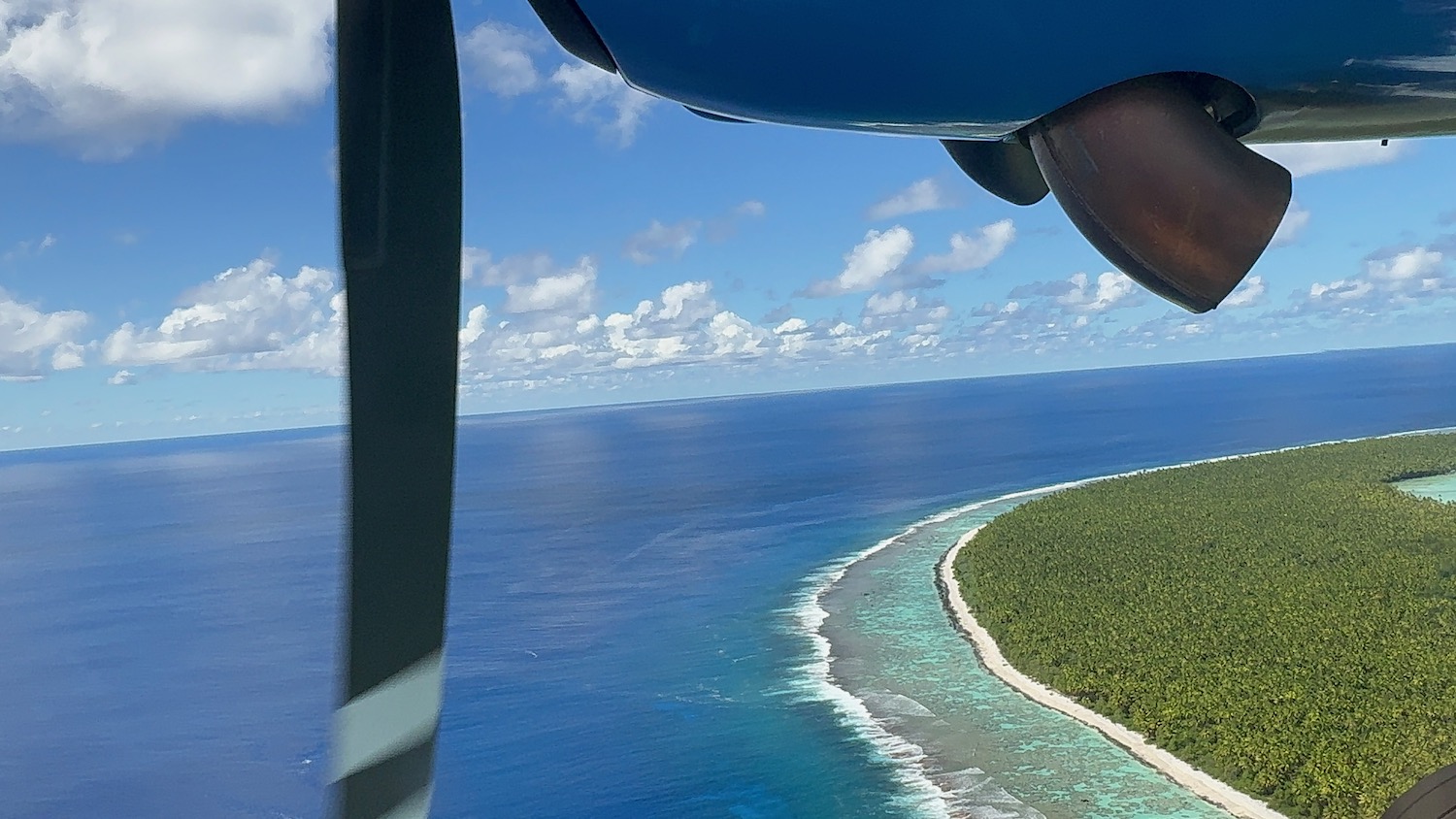 an aerial view of a beach and land