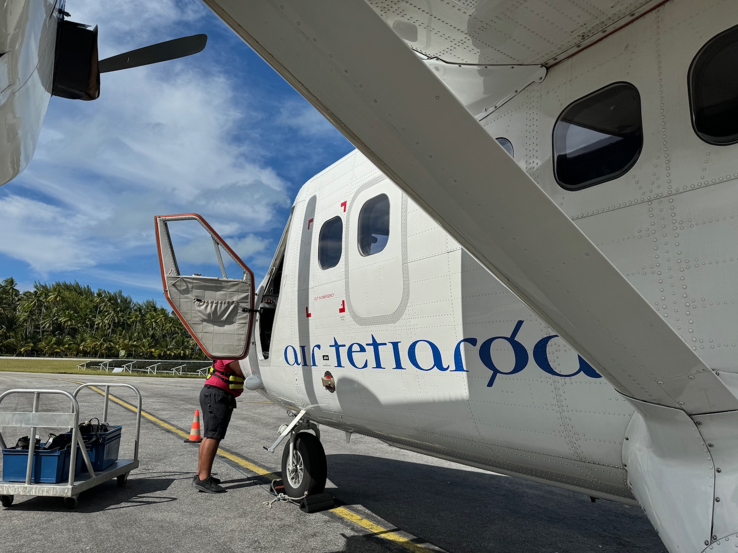 a person standing next to a plane