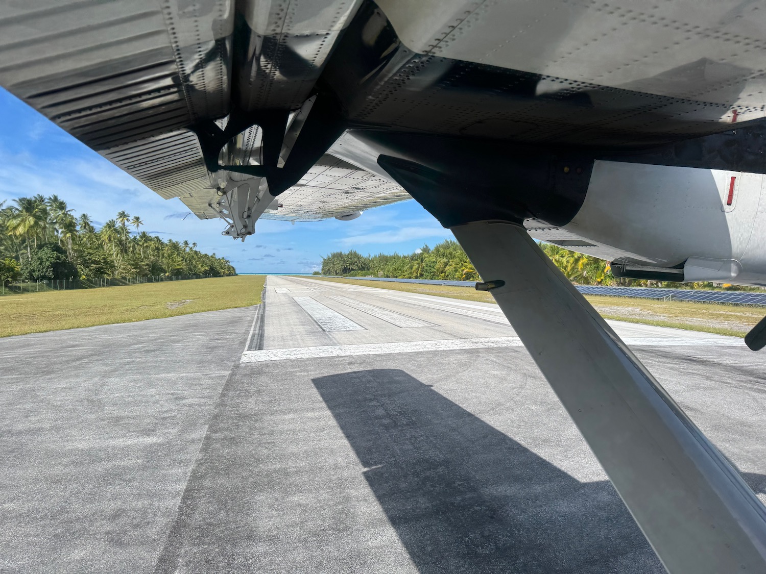 the wing of an airplane on a runway