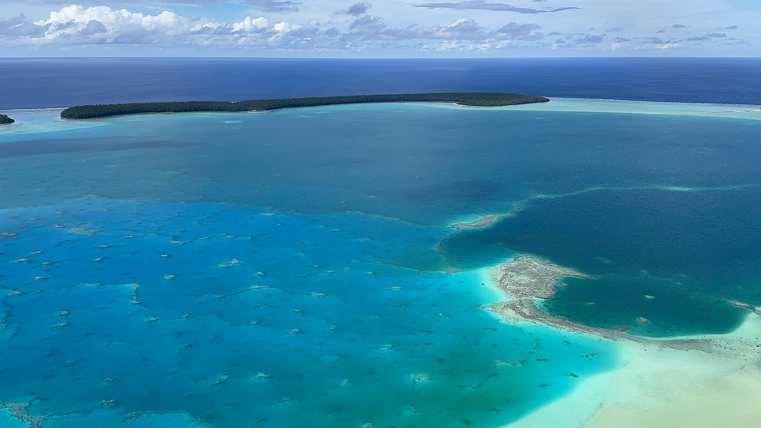 an aerial view of a body of water with islands