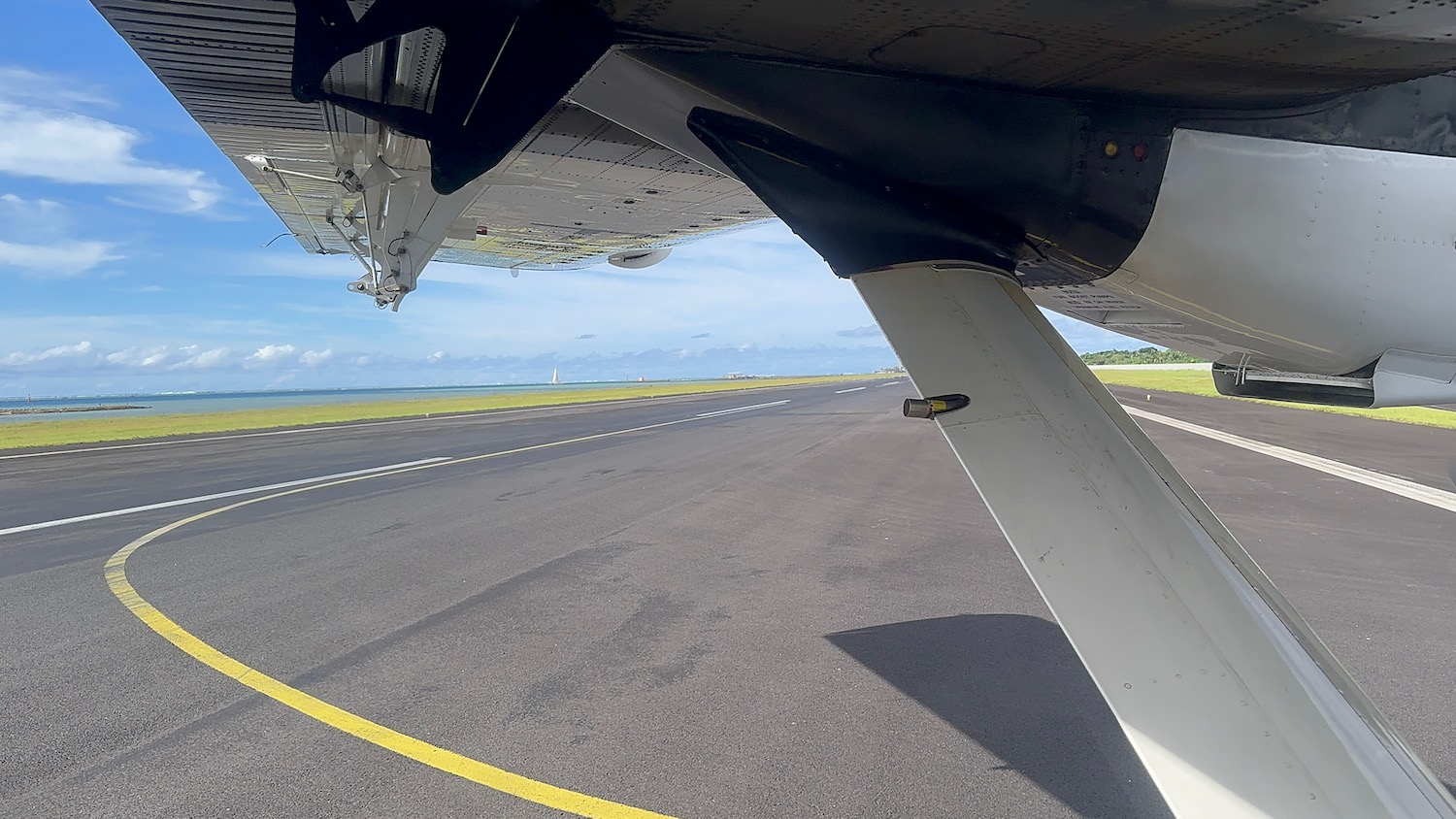 the wing of an airplane on a runway