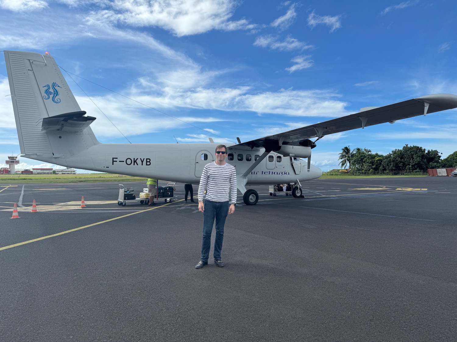 a man standing in front of an airplane