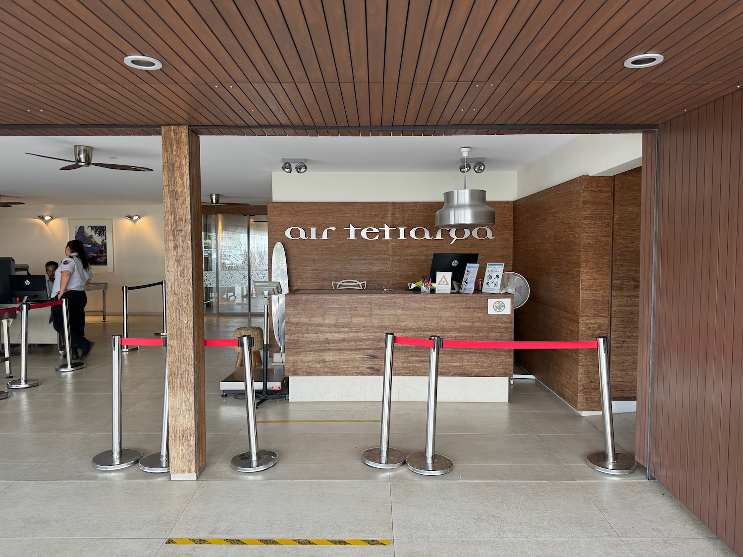 a red rope barrier in front of a reception