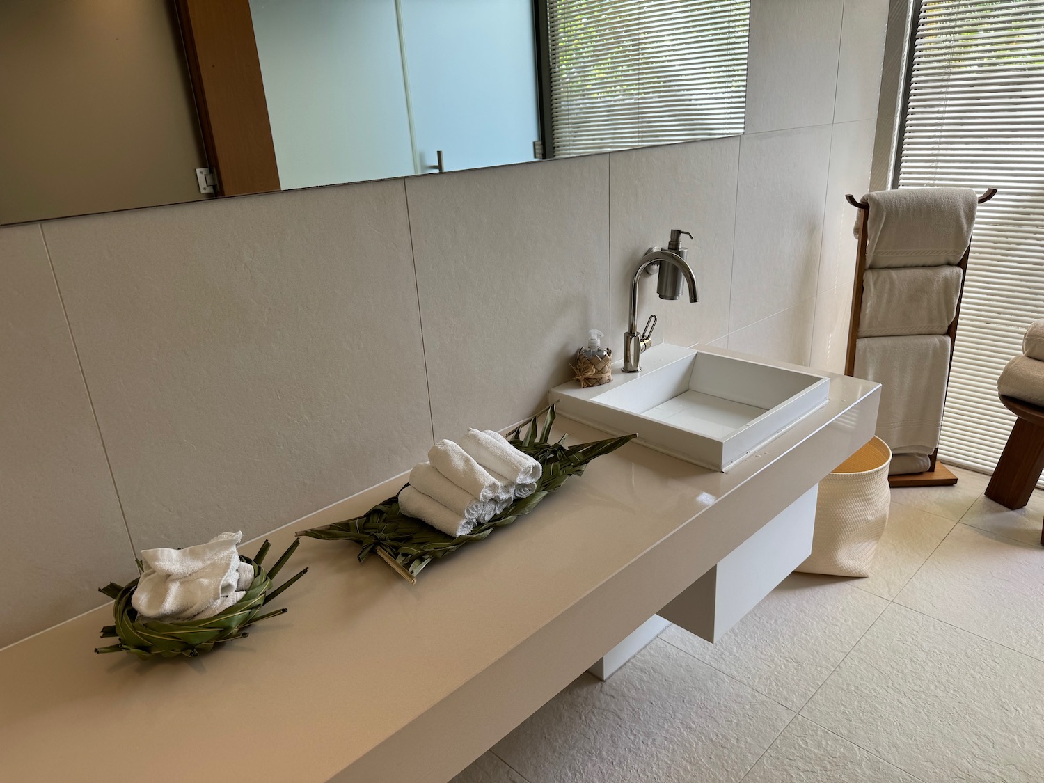 a bathroom with a sink and towels