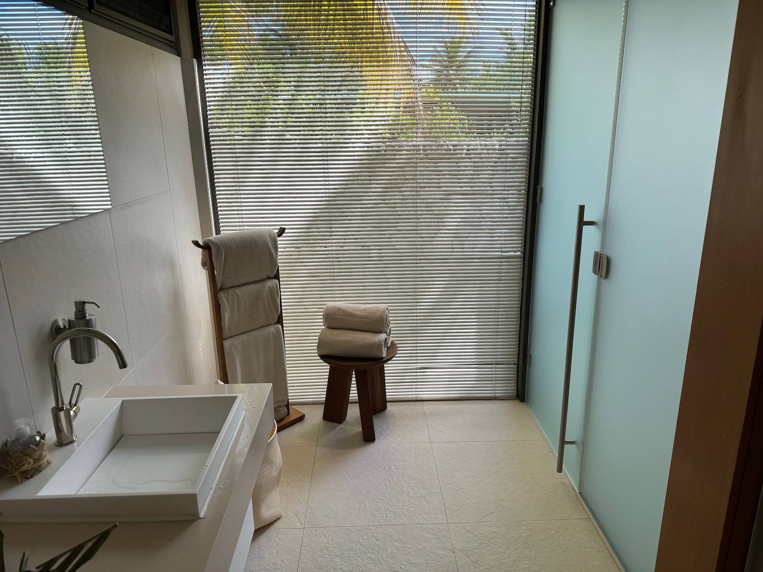 a bathroom with a window and a sink