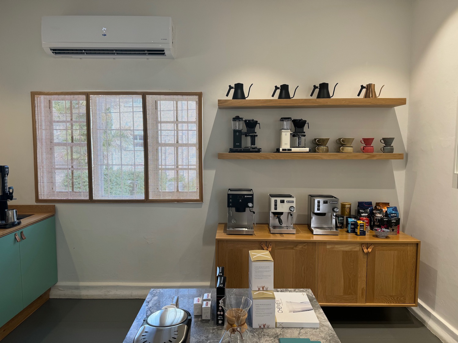a coffee maker on shelves in a room