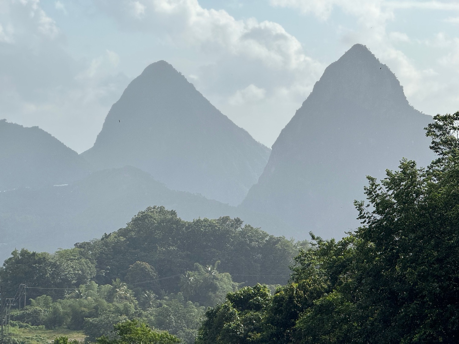 Pitons range with trees and clouds