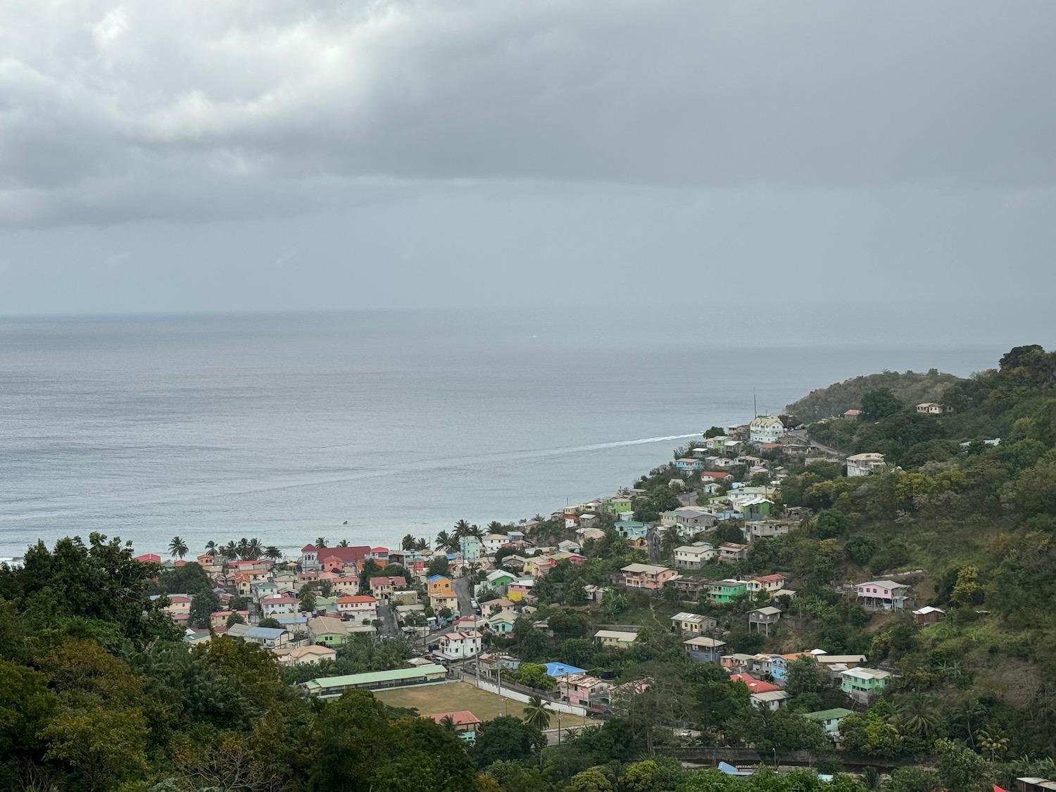 a town on a hill by the ocean