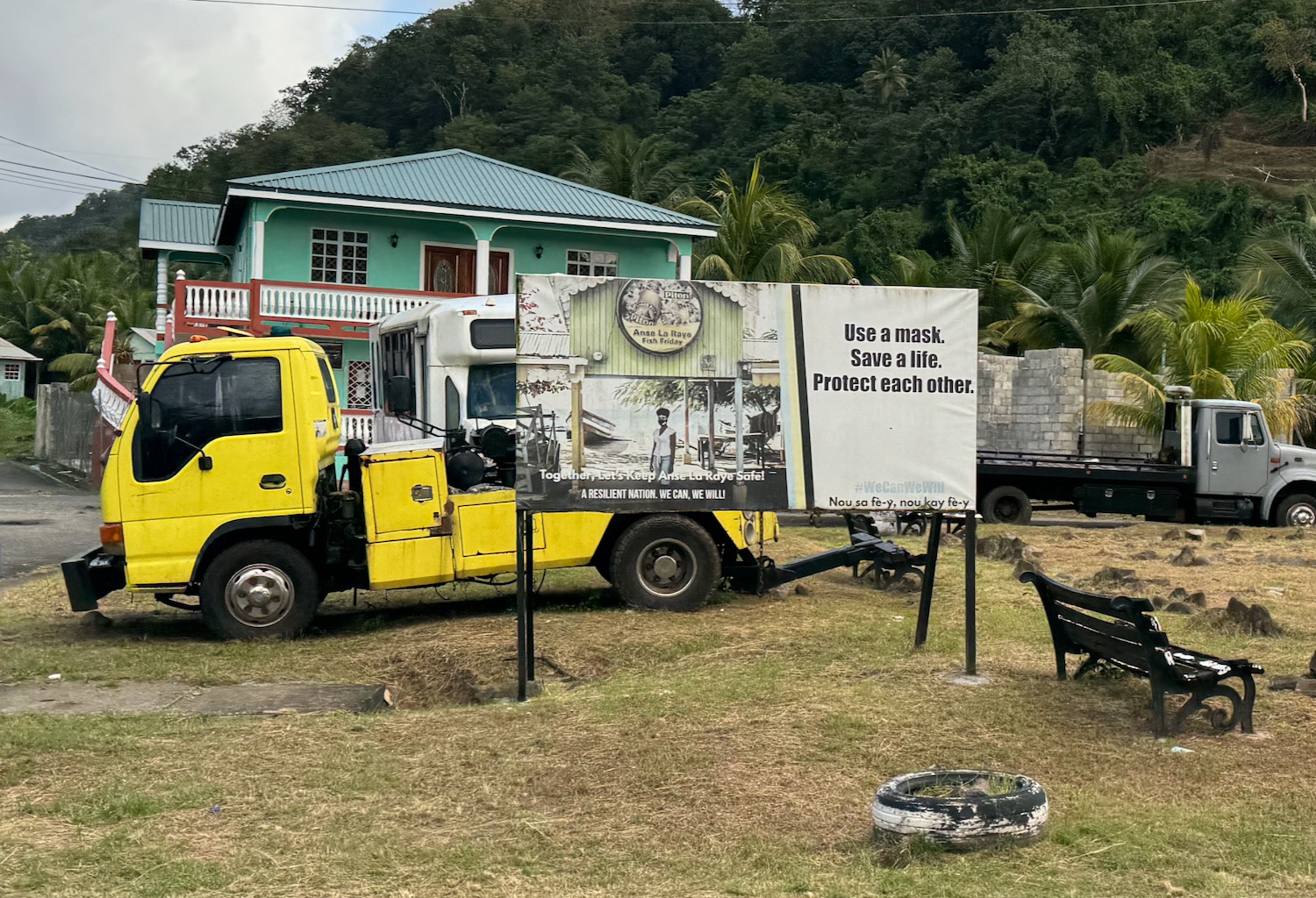 a yellow truck parked in a yard