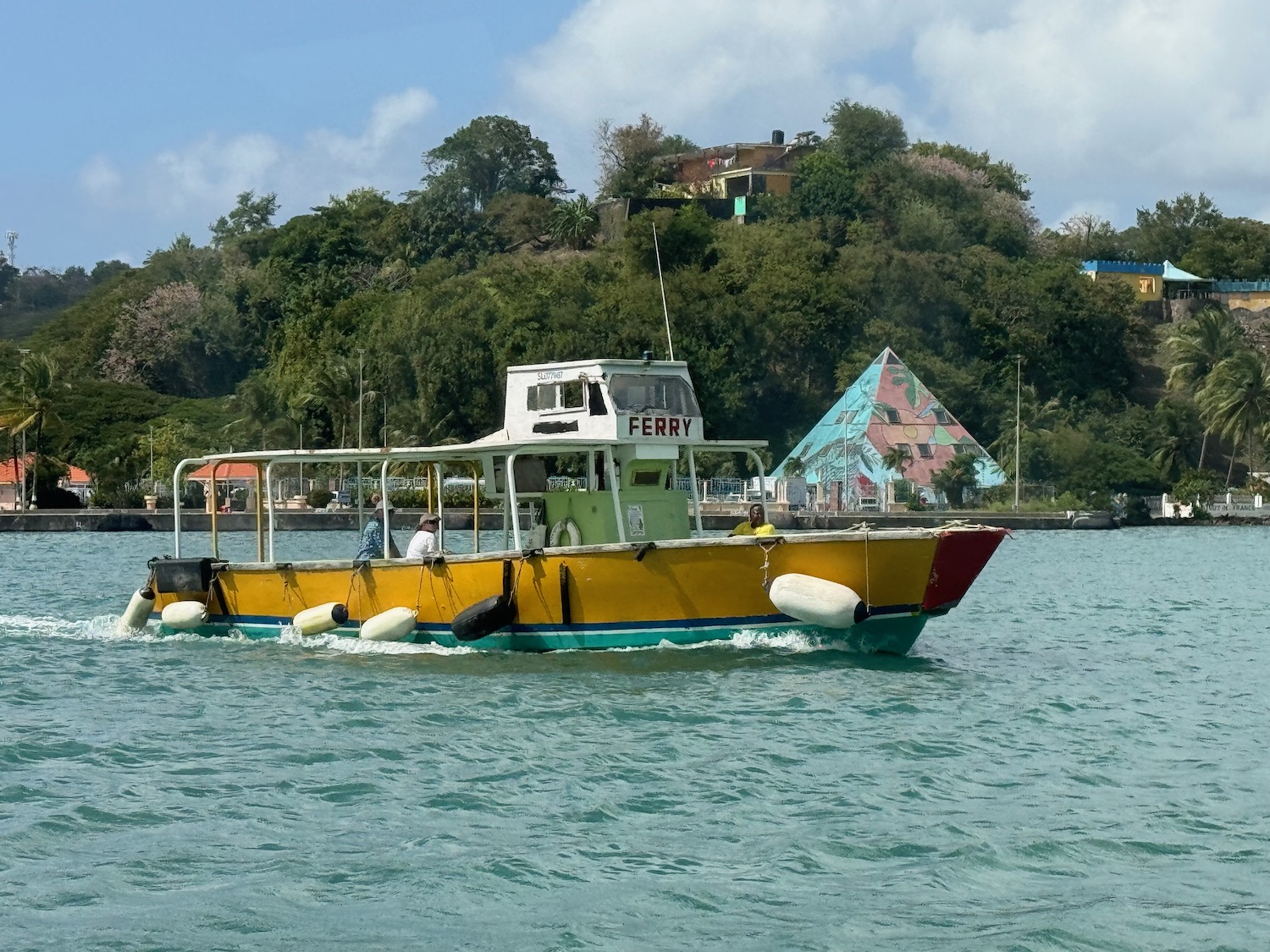 a yellow boat on water