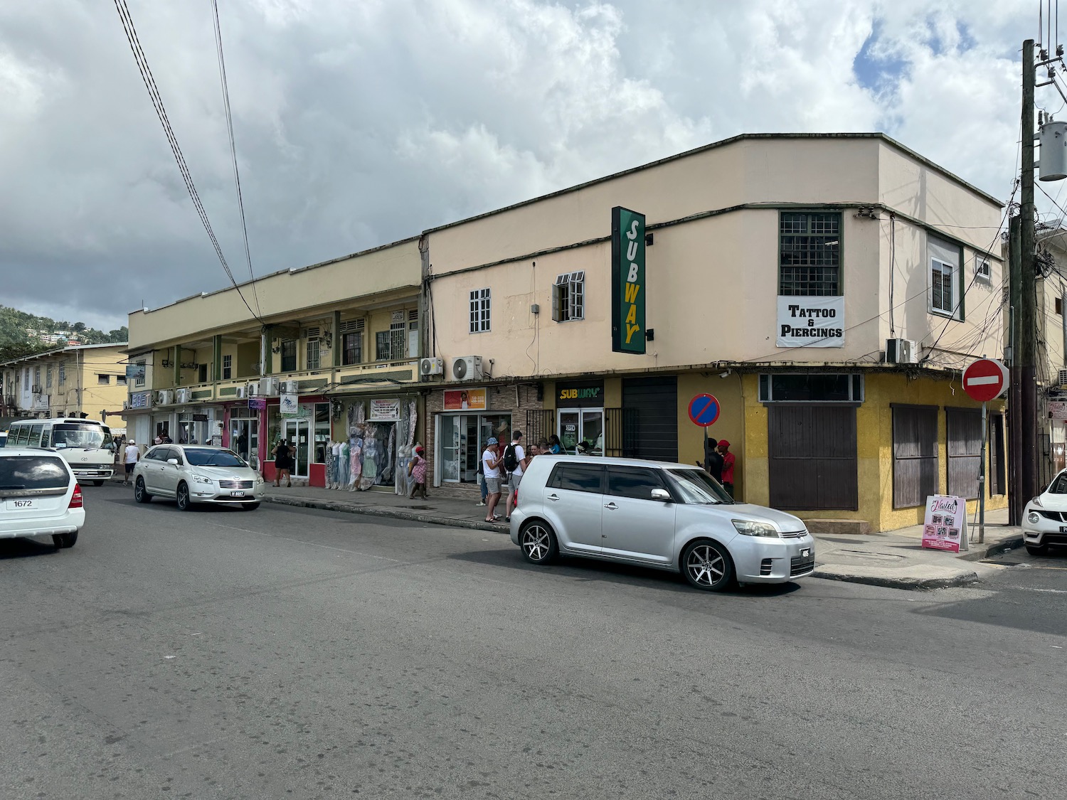 a street with cars and people on it