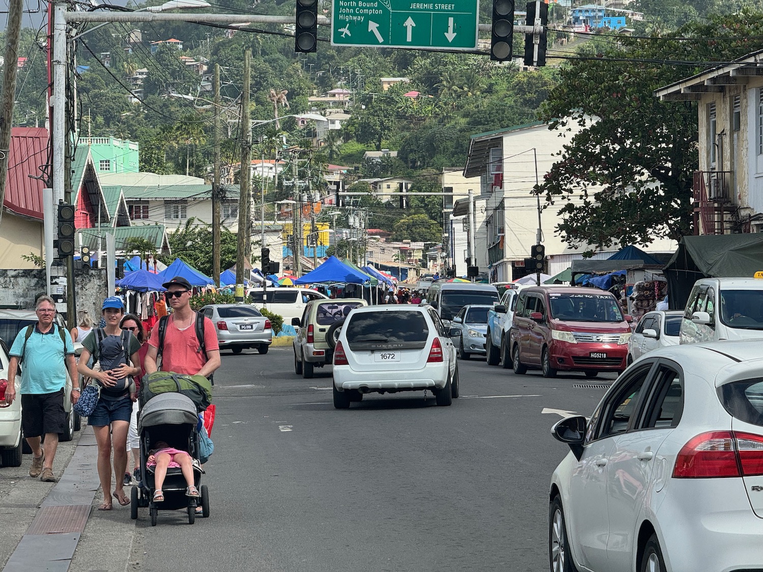 a man pushing a stroller with a child in a stroller