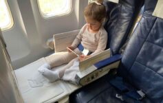 a girl sitting in a plane