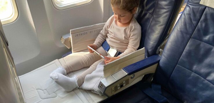 a girl sitting in a plane