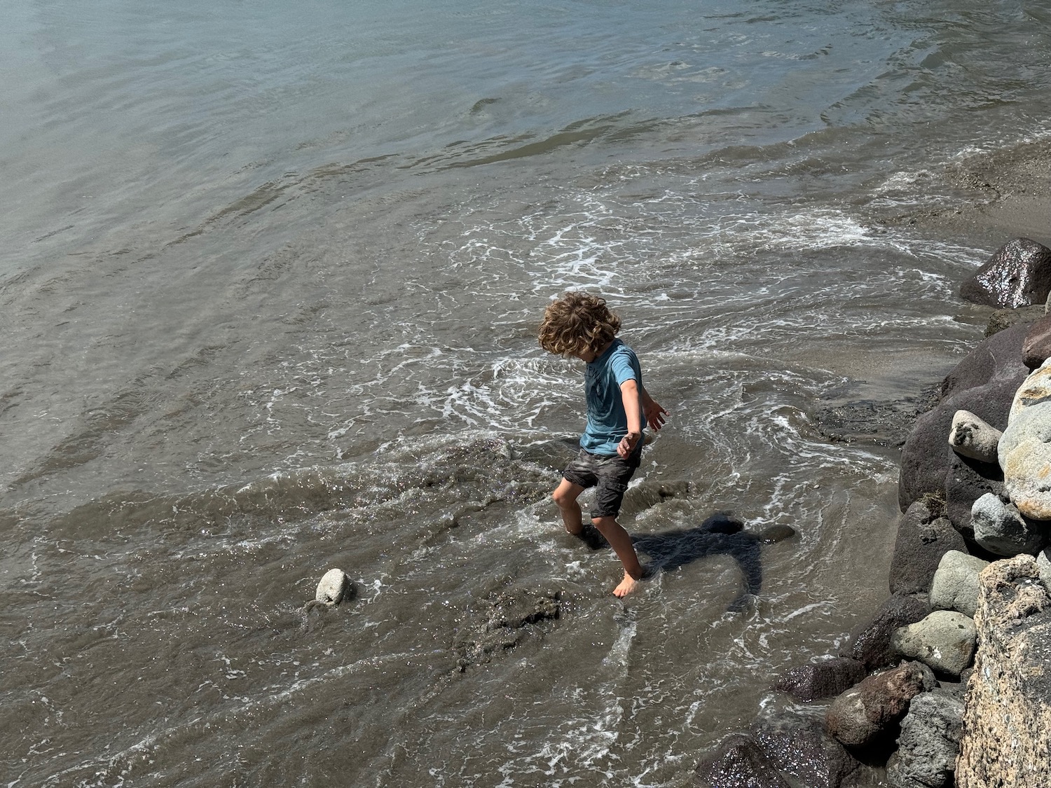 a child playing in the water