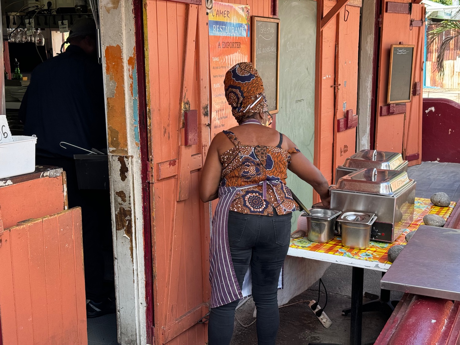 a woman standing outside a restaurant