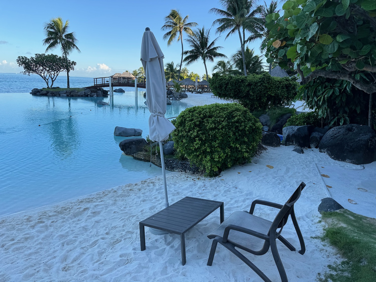 a chair and umbrella on a beach