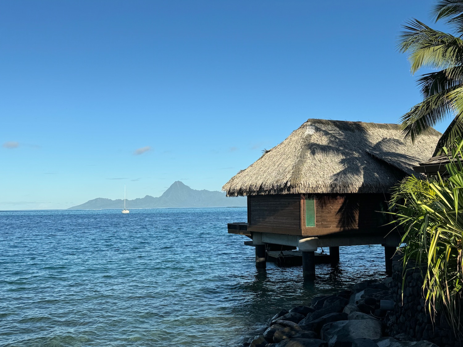 a hut on stilts in the water