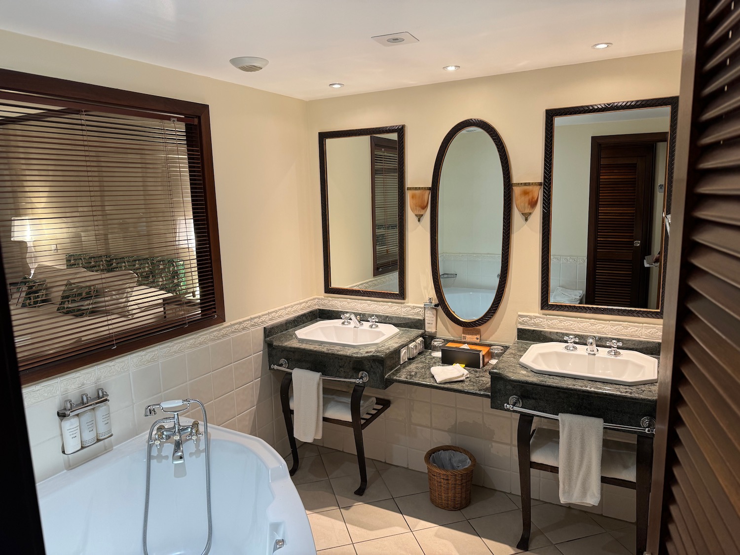 a bathroom with sinks and a tub